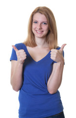 Fototapeta premium Junge Frau mit rötlichen Haaren zeigt beide Daumen