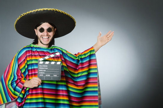 Mexican man with movie board