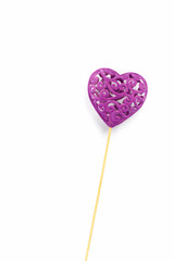 Heart on a stick, Valentine's Day background on white. Selective focus.