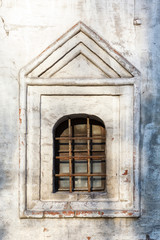 Fototapeta na wymiar white church windows with of forged bars