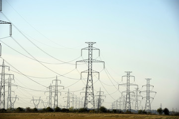 Electricity pylons on the field - daytime shot
