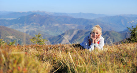 Fototapeta na wymiar Woman in autumn mountain