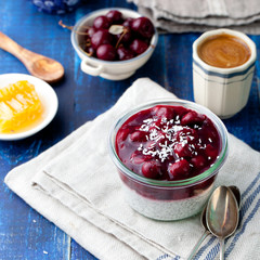 Chia seed pudding, dessert with cherries and granola. 