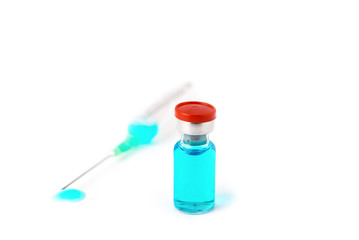a syringe and a bottle with a vaccine on a white background isolated