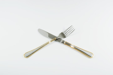 Cuchillo y tenedor cruzados