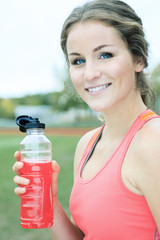 A Runner woman jogging on a field outdoor shot