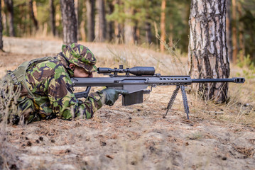 Sharpshooter aiming from his rifle