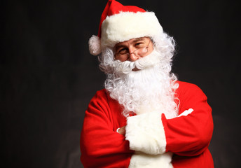 Photo of happy Santa Claus in eyeglasses looking at camera