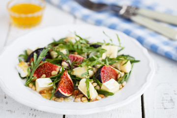 Salad with figs, pine nuts,Camembert Cheese and honey.