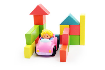 Building with wooden blocks - garage and car - obrazy, fototapety, plakaty