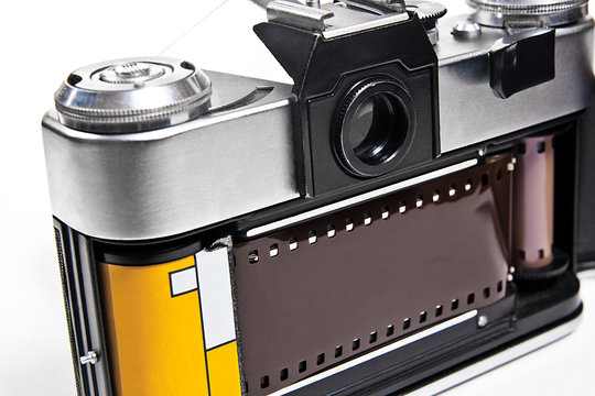 Close up view of old retro camera on white background.