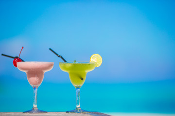 Two tasty cocktails on tropical white beach