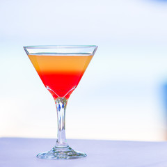 Sweet tasty cocktail on tropical white beach