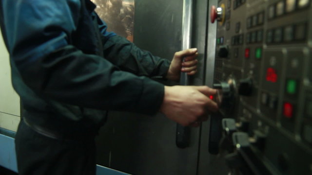 Worker working with cnc machine