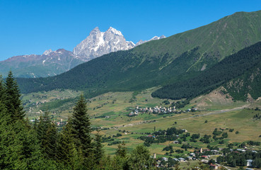 Fototapeta na wymiar Mount Ushba in Caucasus Mountains, Svanetia region in Georgia