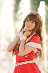 Portrait of beautiful Asian female santa in Christmas