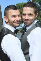 loving gay male couple on their wedding day.