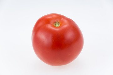 Organic Roma tomatoes on white background.