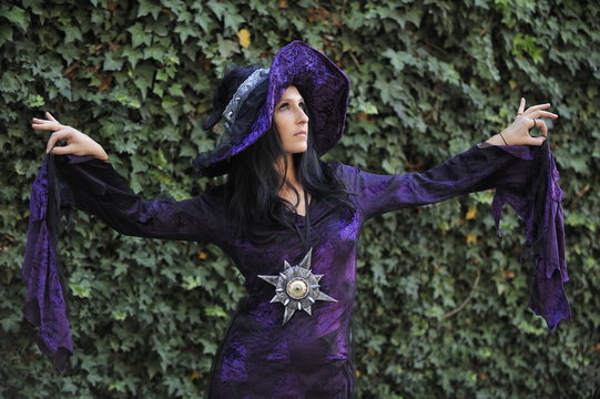 Woman dressed as a witch.
