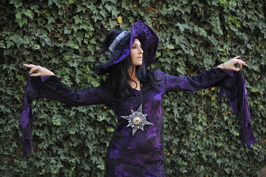 Woman dressed as a witch.
