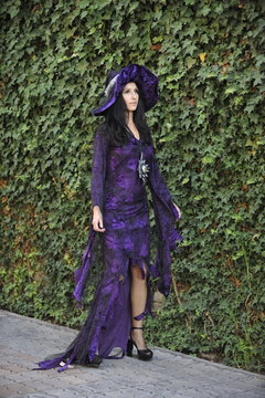 Woman dressed as a witch.
