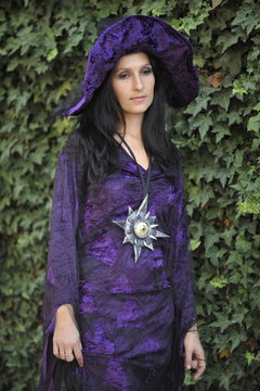 Woman dressed as a witch.
