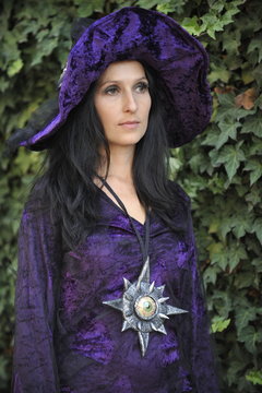 Woman dressed as a witch.
