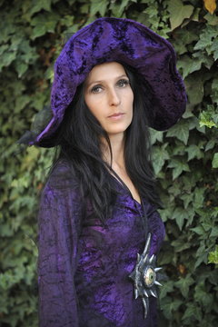 Woman dressed as a witch.
