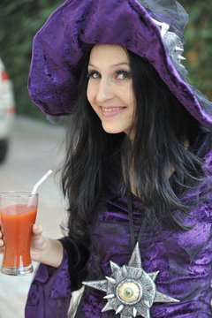 Woman dressed as a witch.
