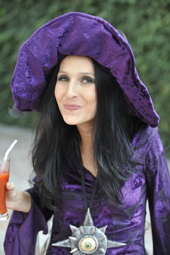 Woman dressed as a witch.
