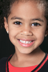 Portrait of a cute african american little boy, isolated on blac