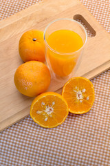 fresh orange juice with slide half orange