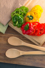 wooden spoons with fresh sweet peppers chili.jpg