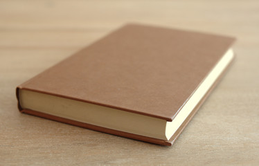 Side view of an old book on a table