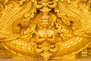 Fototapeta na wymiar Gold Angel Buddha statue on the Wat wall thailand