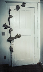 Creepy hands behind door
