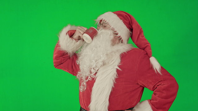 Santa drinks from a red cup on a Green Screen Chrome Key