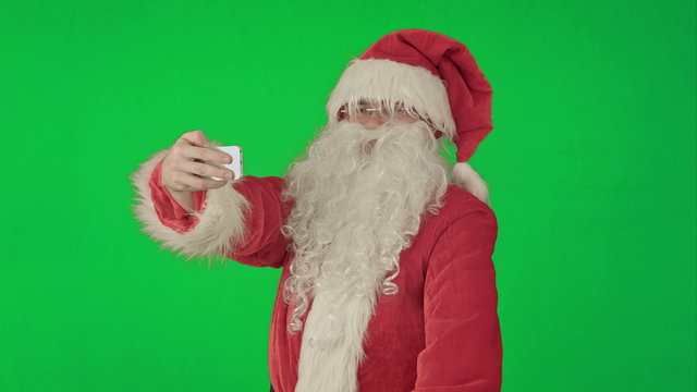 Santa Claus doing a selfie on a Green Screen Chrome Key
