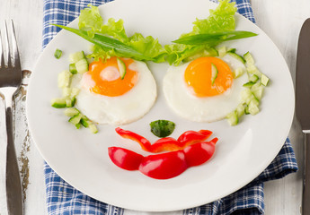 Fried eggs with vegetables for a healthy breakfast.