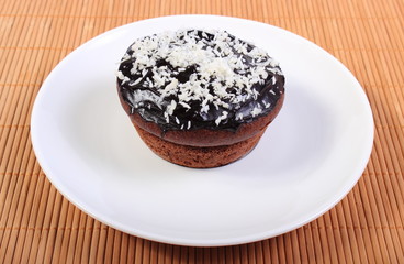 Fresh baked chocolate muffins with desiccated coconut