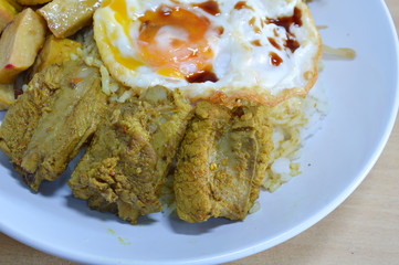curry pork rib and fried egg on rice