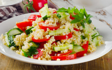 Salad with bulgur, parsley and vegetables.