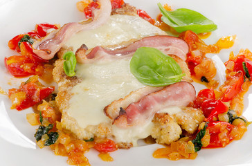 Chicken breast fillet baked with cheese, bacon and tomato.