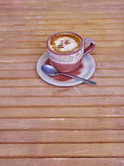 capuccino coffee in brown cup, cinnamon assorted