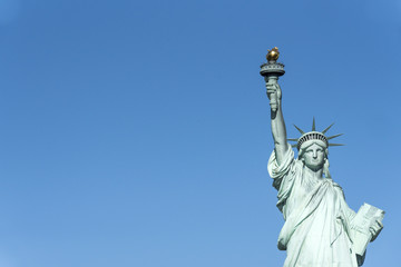 Statue of Liberty or Green Lady in New York City seen from a tourist cruise. The place is a major tourist landmark © TOimages