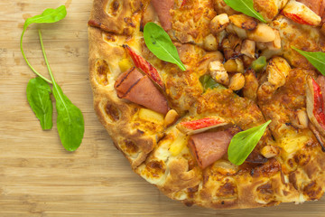 Hot Pizza Top View with Pineapple, Ham and Bell Pepper