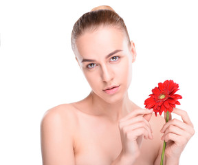 Fototapeta na wymiar Woman posing with red gerbera. Isolated on white background