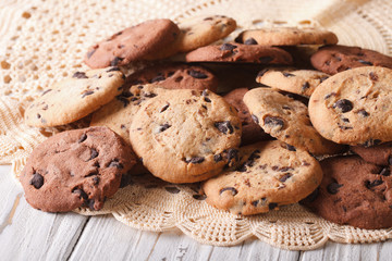 chocolate chips cookies close-up on a lace doily. horizontal

