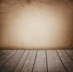 Grunge wall and wood paneled floor, interior of a room.