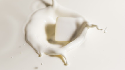 white chocolate falls in milk